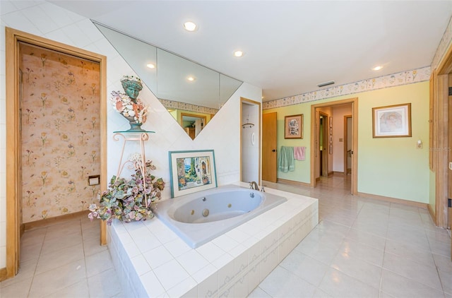 bathroom featuring tile floors and a relaxing tiled bath