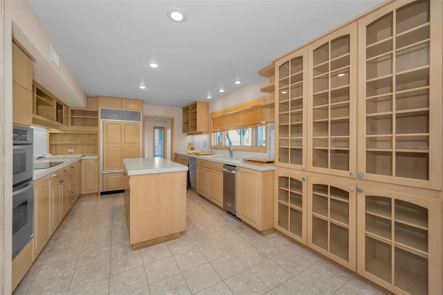 kitchen featuring light brown cabinets, a kitchen island, and open shelves