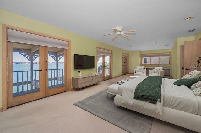 carpeted bedroom with access to outside, french doors, and visible vents