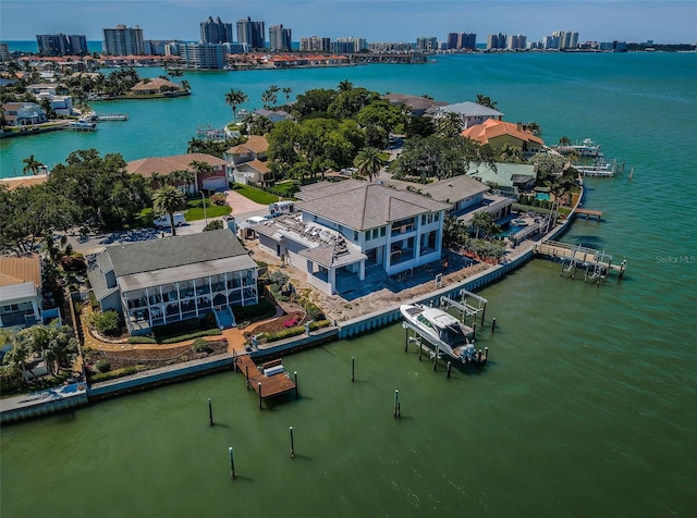 bird's eye view with a water view and a view of city