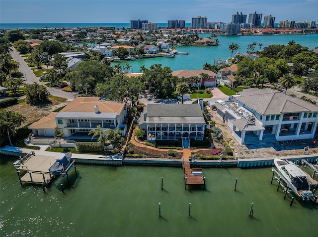 aerial view with a water view and a view of city