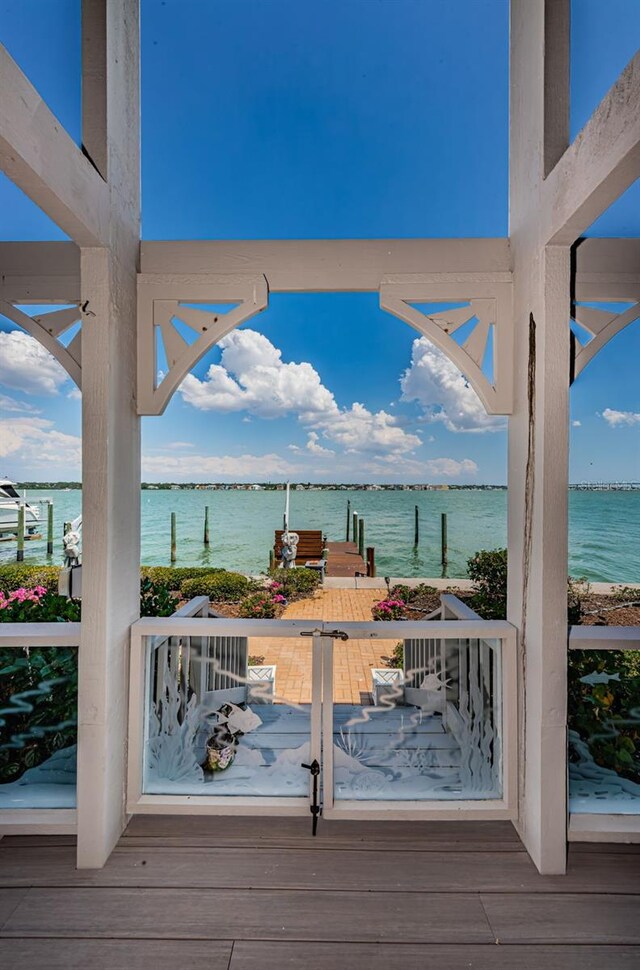 wooden deck with a water view