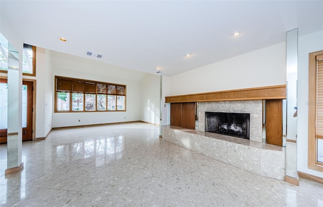 526 Belle Isle Ave, Belleair Beach, FL 33786 - unfurnished living room with baseboards, a tile fireplace, and recessed lighting