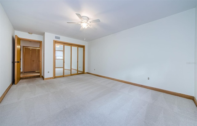 526 Belle Isle Ave, Belleair Beach, FL 33786 - unfurnished bedroom featuring visible vents, a ceiling fan, baseboards, and light carpet