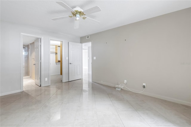 spare room with ceiling fan and a textured ceiling