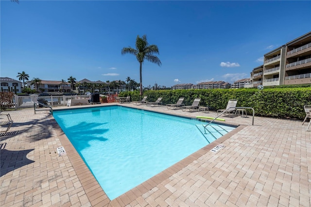 view of swimming pool with a patio area