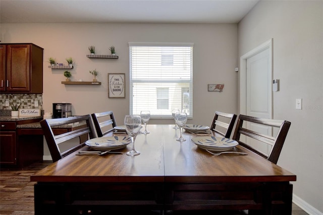 dining space featuring dark wood-type flooring