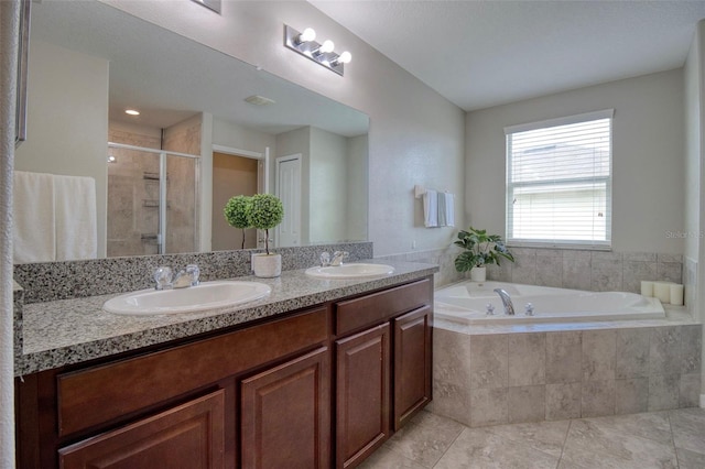 bathroom with plus walk in shower, tile patterned flooring, and vanity