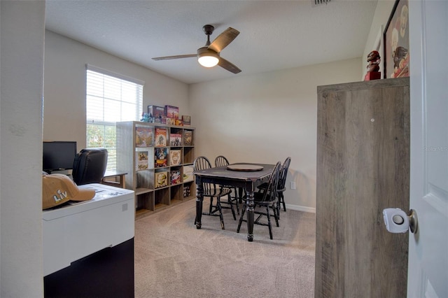 office area with ceiling fan and light colored carpet