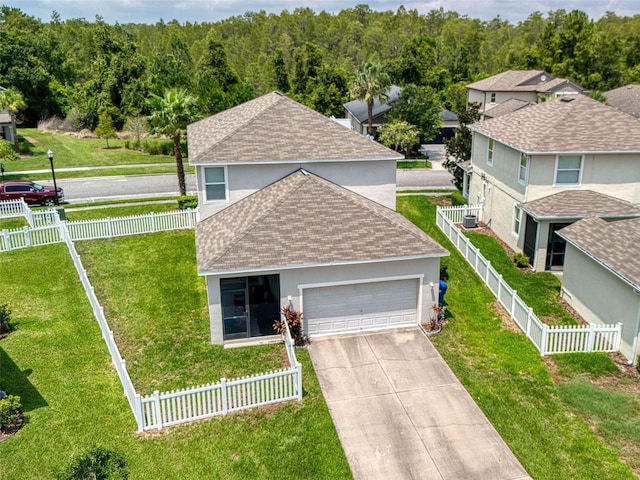 view of front of home featuring a garage and a front yard