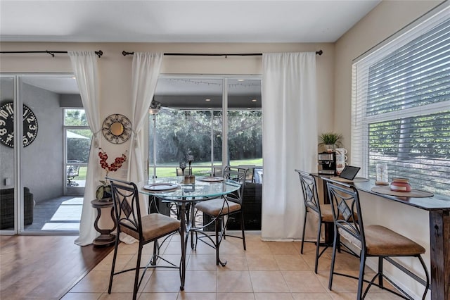 dining area with light tile patterned floors