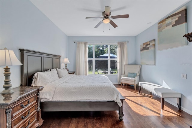 bedroom featuring ceiling fan and dark wood-type flooring