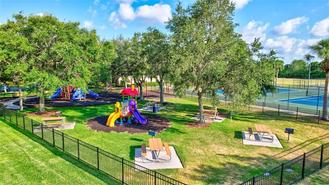 surrounding community with a lawn, a playground, and tennis court