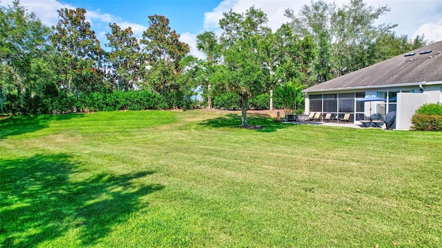 view of yard with a sunroom