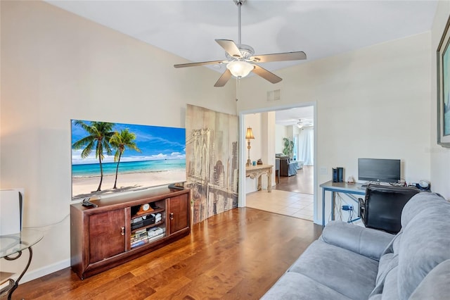 living room featuring ceiling fan, wood finished floors, and visible vents