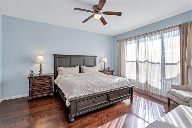 bedroom with ceiling fan and dark hardwood / wood-style flooring