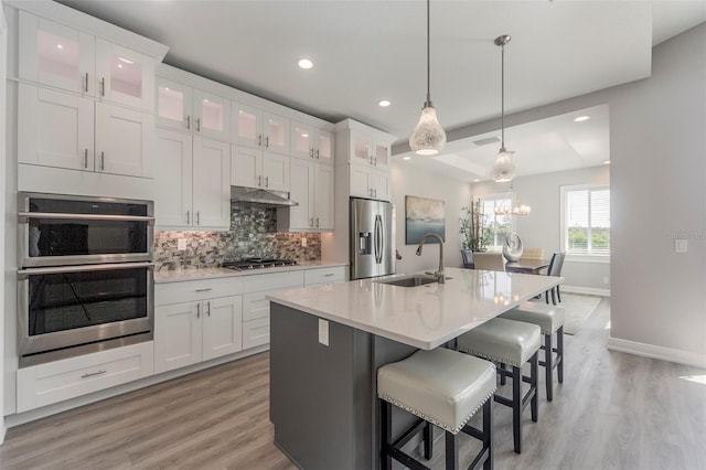 kitchen featuring white cabinets, sink, and appliances with stainless steel finishes