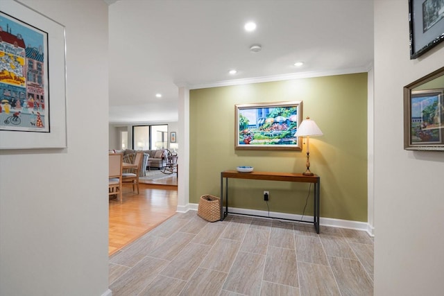 hall featuring ornamental molding, recessed lighting, baseboards, and wood finished floors