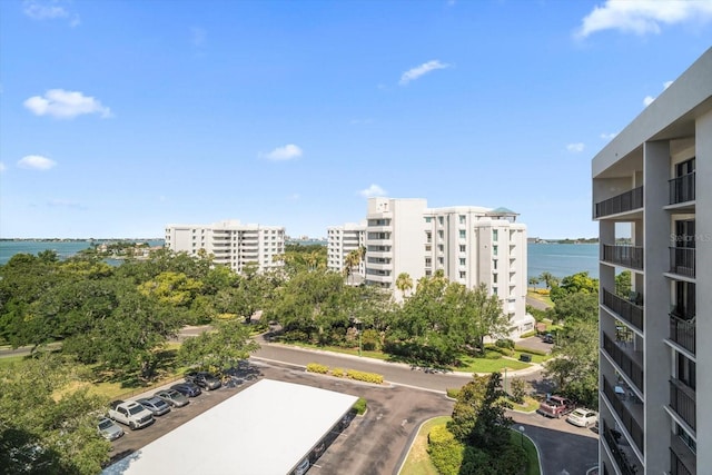 view of property with a city view and a water view