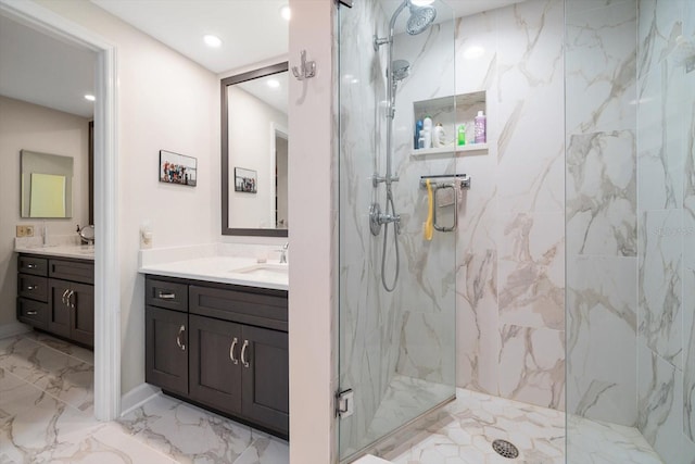 bathroom with recessed lighting, marble finish floor, vanity, and a marble finish shower