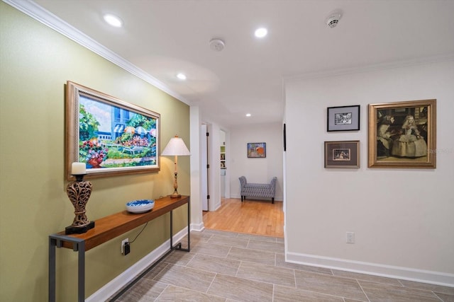 hallway with baseboards, ornamental molding, and recessed lighting