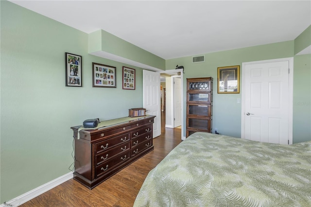 bedroom featuring dark wood-type flooring