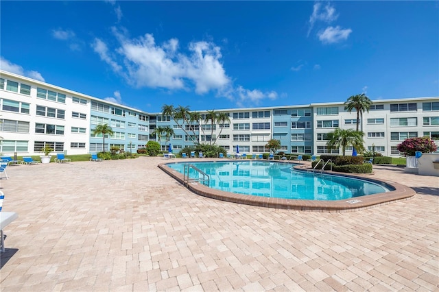 view of swimming pool with a patio