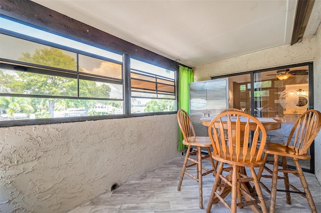 sunroom / solarium with ceiling fan