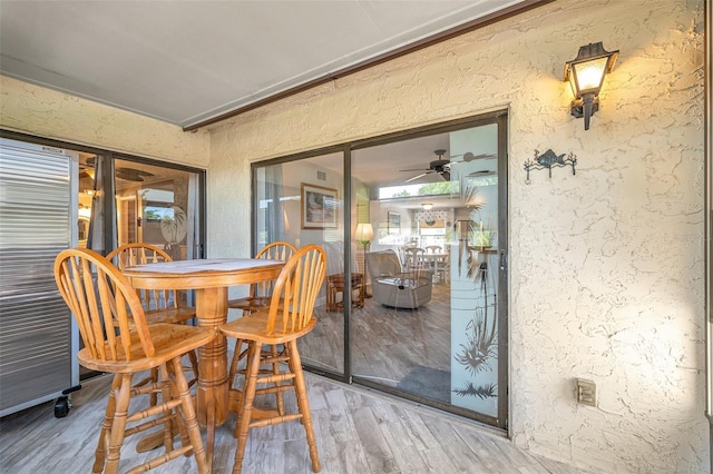 sunroom / solarium with ceiling fan