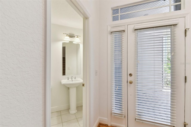 bathroom with tile patterned floors