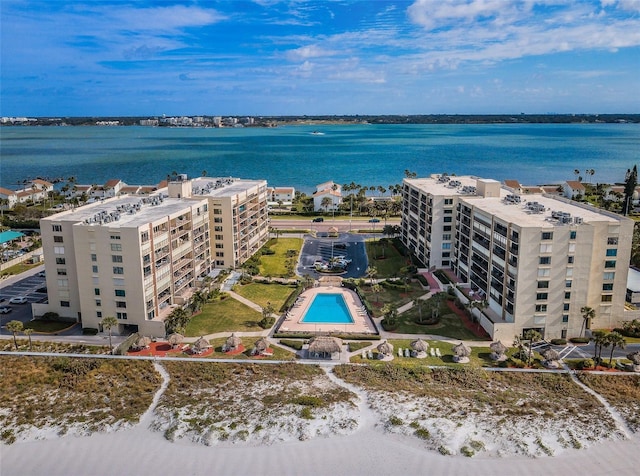 birds eye view of property with a water view