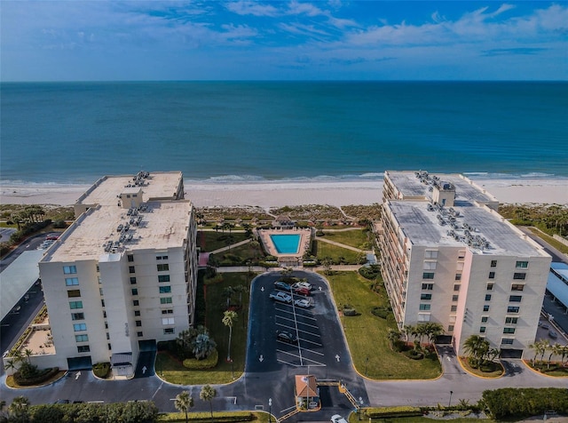 birds eye view of property featuring a view of the beach and a water view