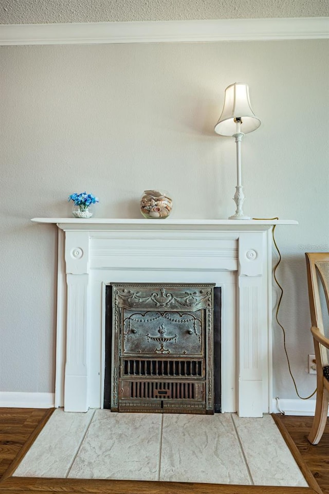 details featuring wood-type flooring and crown molding