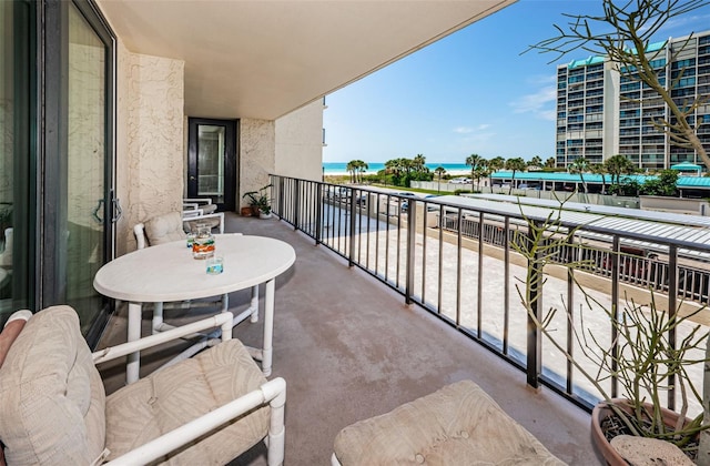 balcony featuring a water view