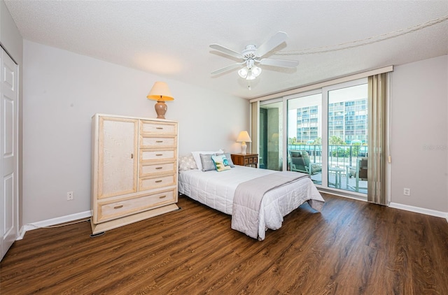 bedroom featuring a textured ceiling, ceiling fan, access to exterior, and dark wood-type flooring