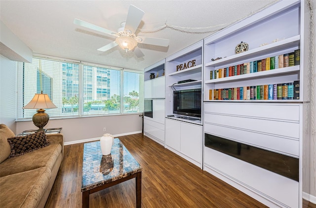 interior space featuring a textured ceiling, ceiling fan, and dark hardwood / wood-style floors