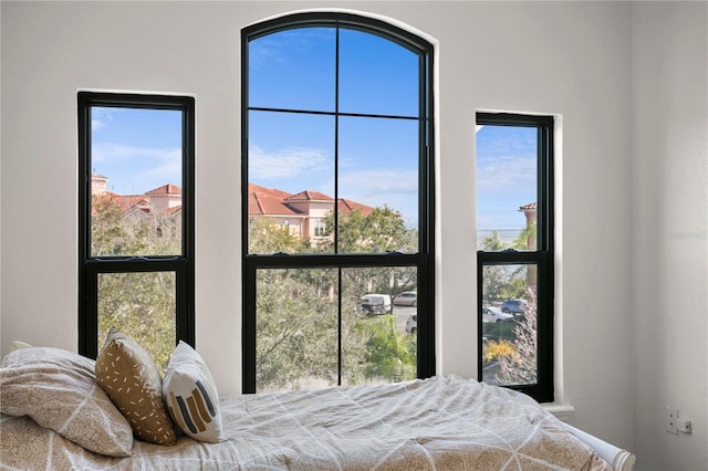 bedroom with multiple windows