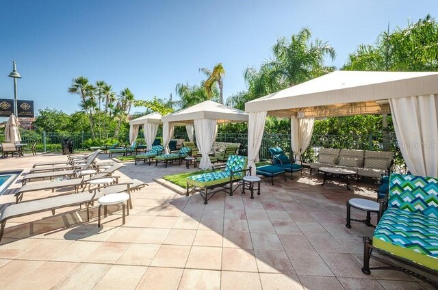 view of patio / terrace with an outdoor living space and a gazebo