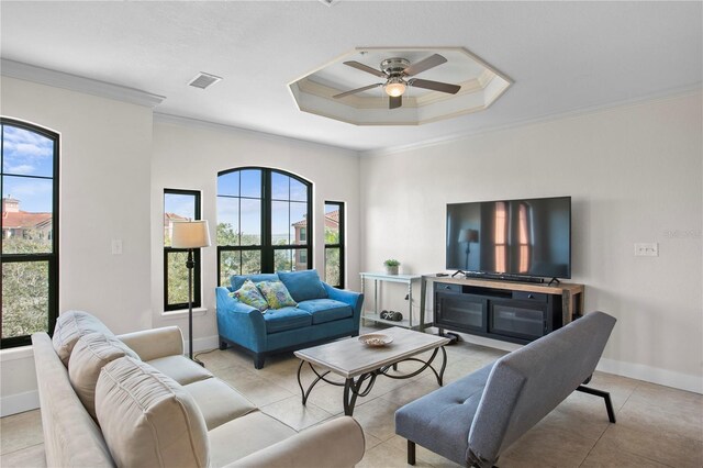 living room featuring ceiling fan, light tile patterned floors, plenty of natural light, and ornamental molding