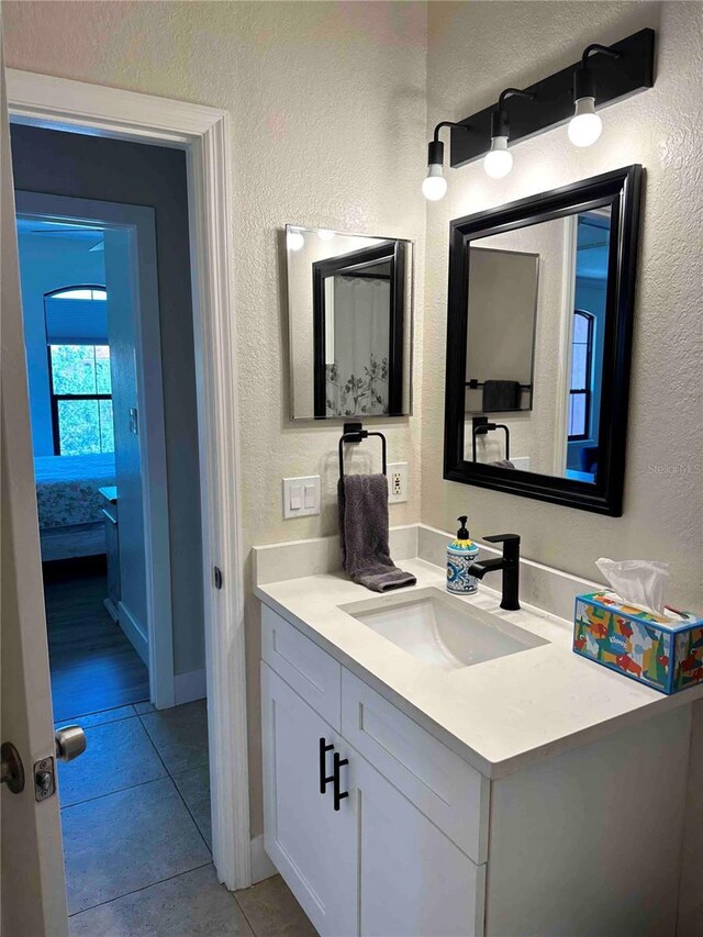 bathroom featuring vanity and tile patterned flooring