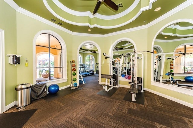 workout area with ceiling fan and a healthy amount of sunlight