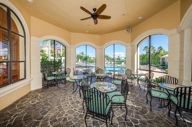 view of patio featuring ceiling fan