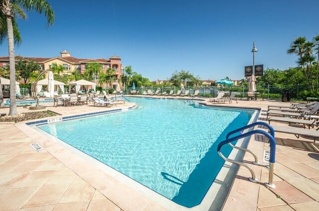 view of swimming pool with a patio