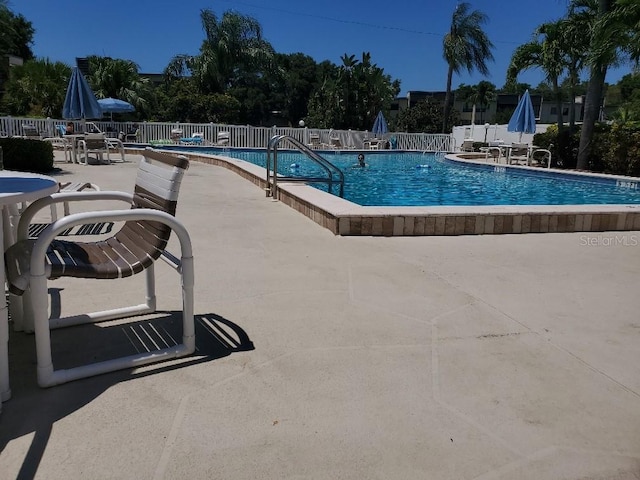 view of swimming pool with a patio area