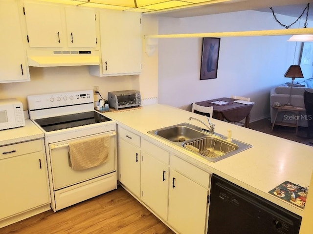 kitchen with black dishwasher, white cabinets, and range