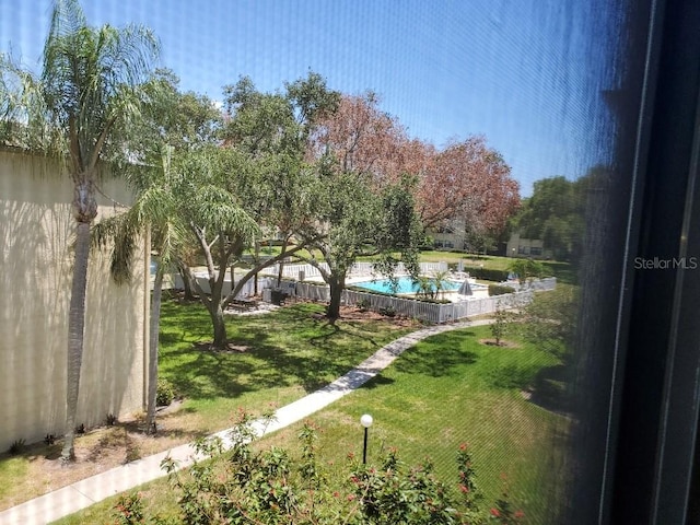 view of yard featuring a fenced in pool