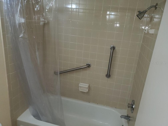 bathroom with shower / tub combo with curtain