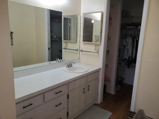 bathroom featuring vanity and wood-type flooring