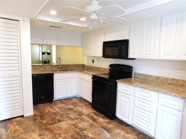 kitchen featuring ceiling fan, sink, light stone counters, white cabinets, and black appliances