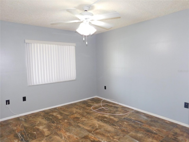 unfurnished room featuring a textured ceiling and ceiling fan